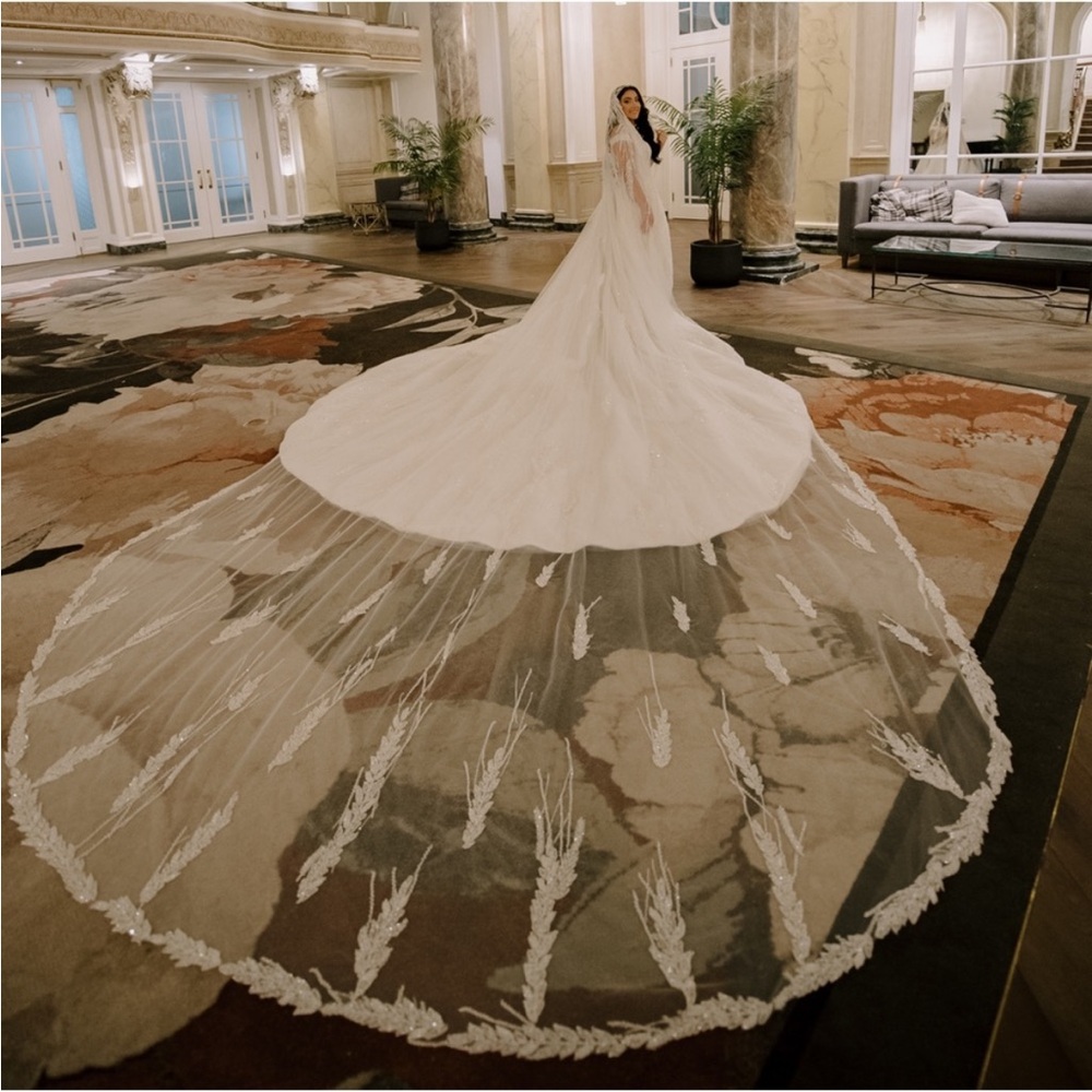 Custom handmade wedding dress/gown
Designed with 5 meter veil &3 meteroverskirt